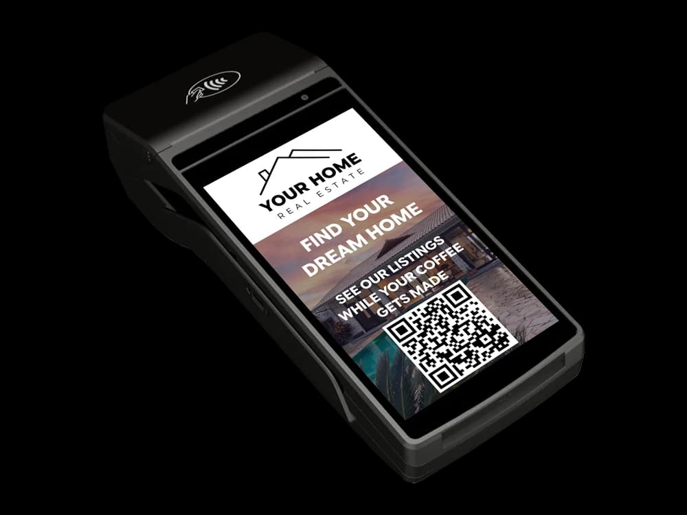 A real estate agency ad with a scannable QR code running on a payment terminal